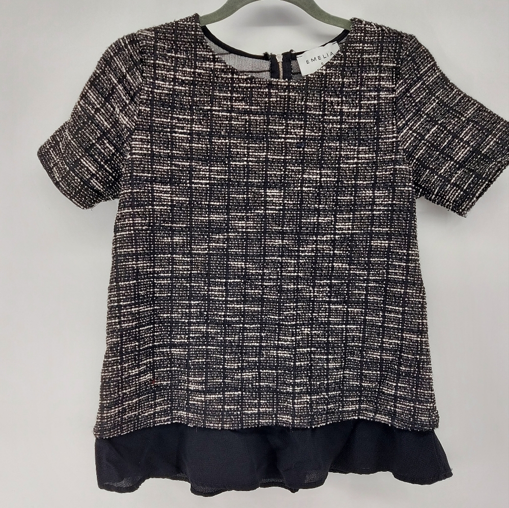 Emelia black and white short sleeve blouse with sheer ruffle bottom
